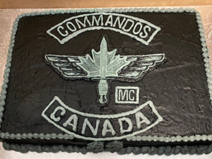 Photo of a white on black Commandos Canada cake from a Border Town meeting